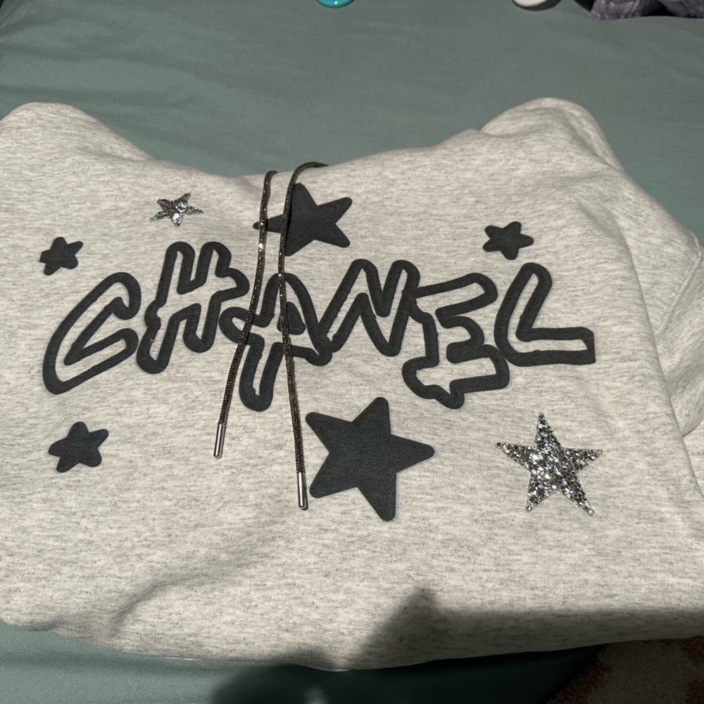 Chanel labeled hoodie with rhinestone stars and drawstring